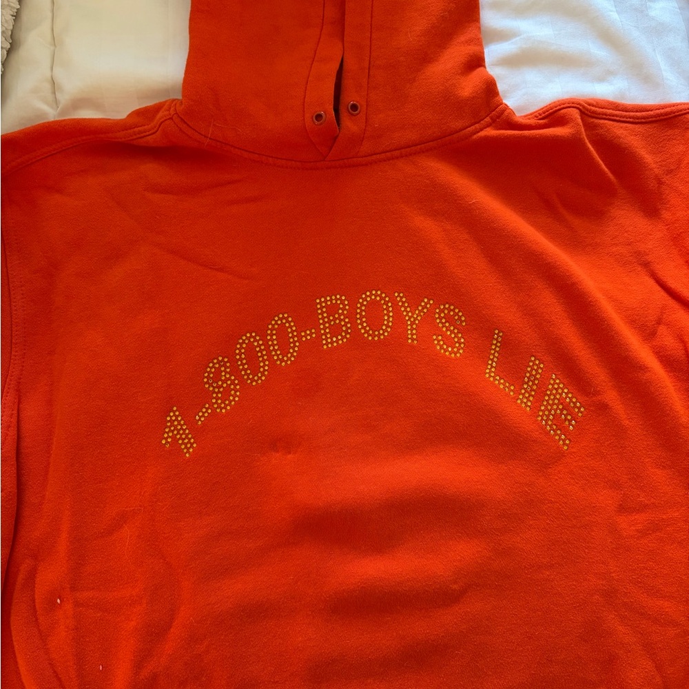 Orange Hoodie with Studded "1-800-BOYS LIE" Graphic